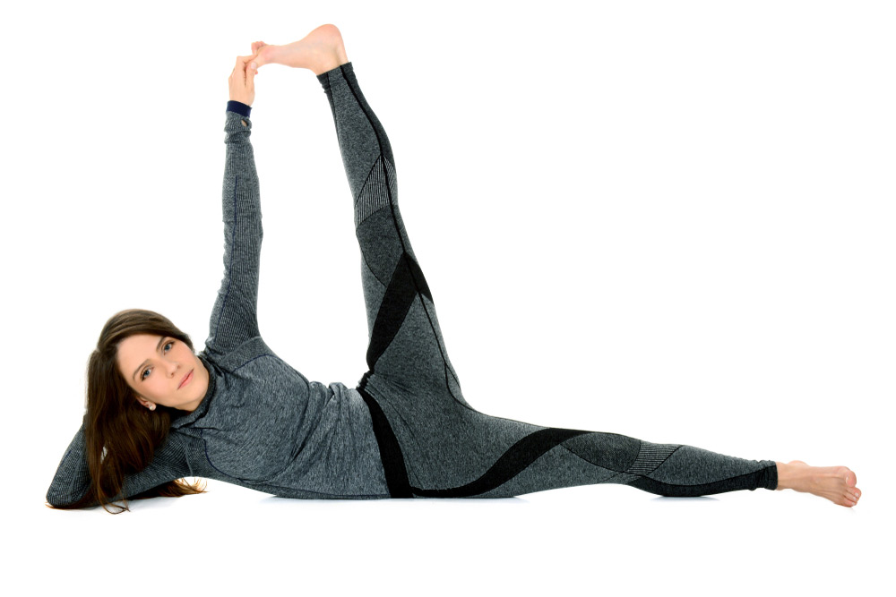 side reclining leg lift yoga pose